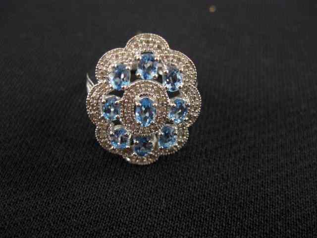 Appraisal: Blue Topaz Diamond Ring oval gems with diamonds throughout carats