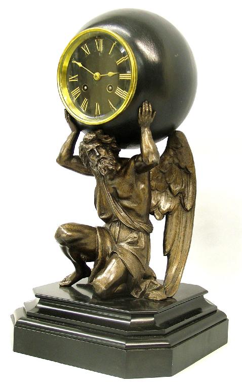 Appraisal: French bronzed spelter and black marble two train Atlas clock