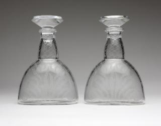 Appraisal: A pair of Baccarat etched clear crystal decanters Mid- th