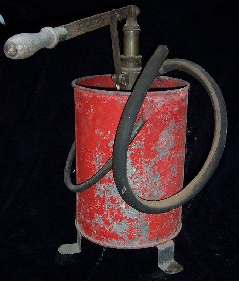 Appraisal: A Merryweather Sons stirrup pump fire extinguisher and the red