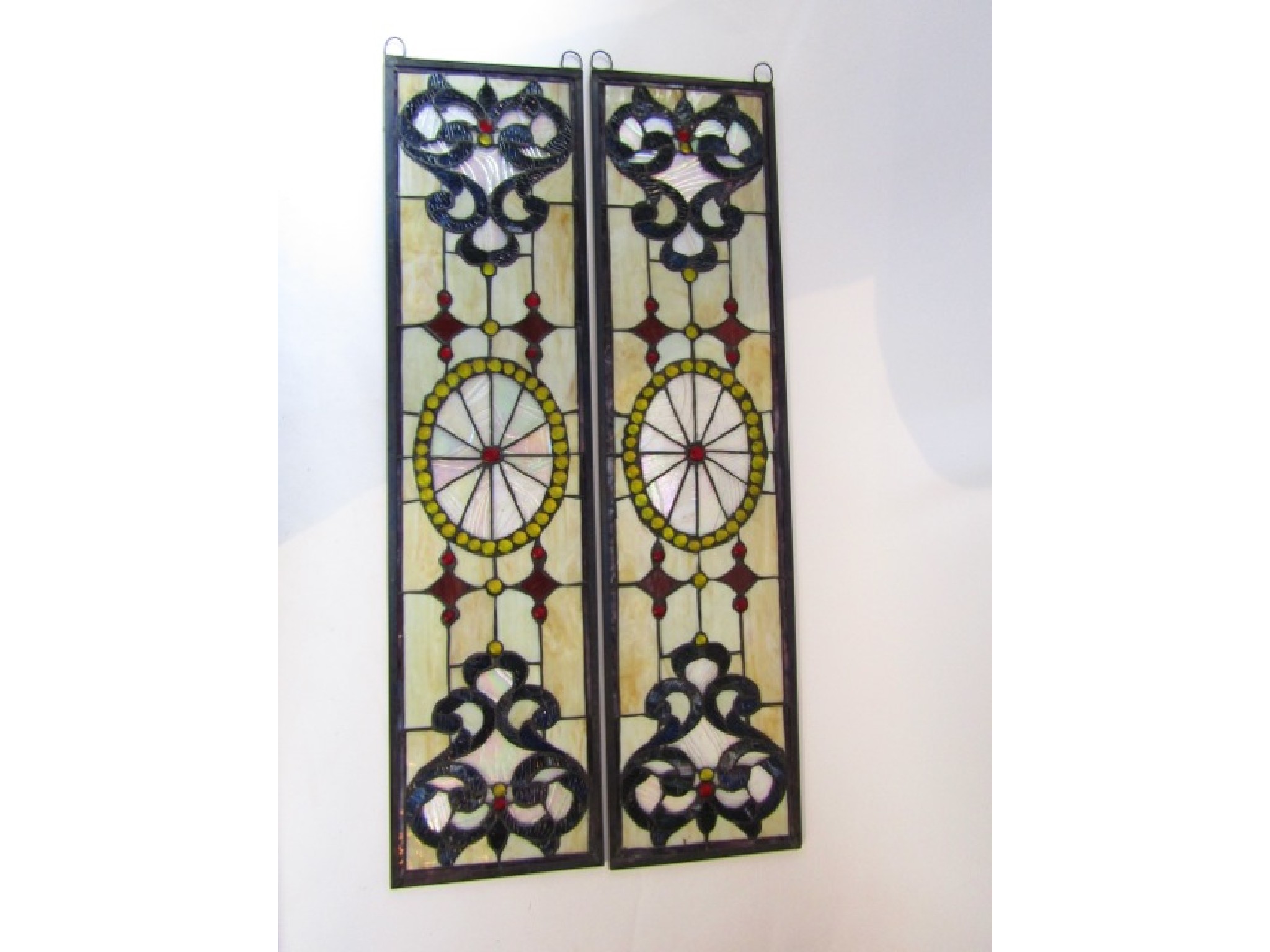 Appraisal: A pair of leaded glass panels of rectangular form with