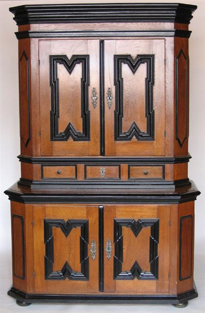 Appraisal: German oak and ebonized cupboard th century The molded cornice