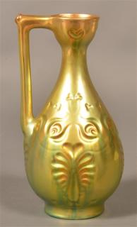 Appraisal: Zsolnay Hungary Green Eosin iridescent Ewer Molded anthemion and floral