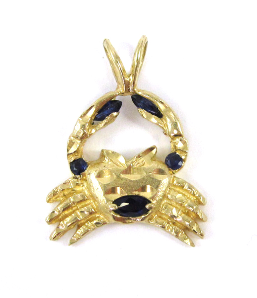 Appraisal: SAPPHIRE AND FOURTEEN KARAT GOLD PENDANT The yellow gold crab