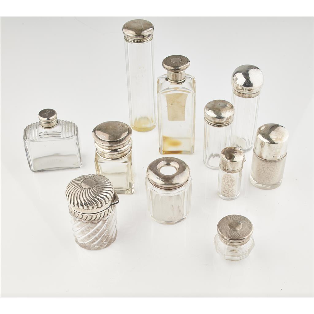 Appraisal: A group of silver mounted bottles the glass jars and