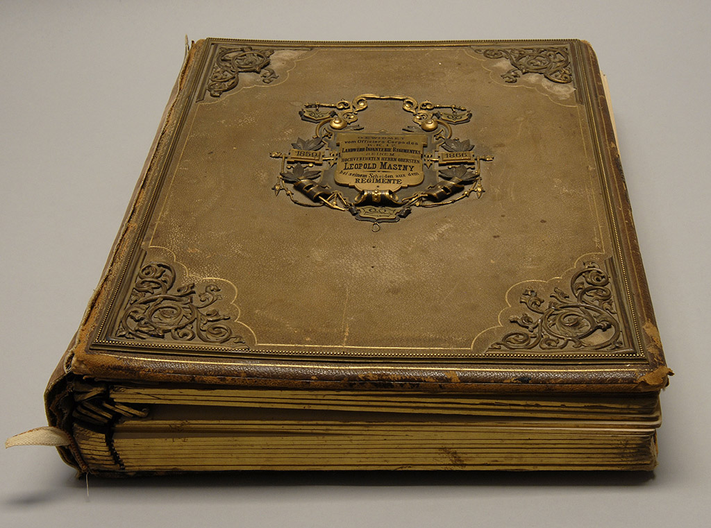 Appraisal: PRUSSIAN REGIMENTAL PHOTO ALBUM Leather-bound book with brass face plate