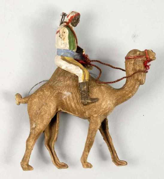 Appraisal: German Dresden Camel Rider Ornament Description Missing upper arm and