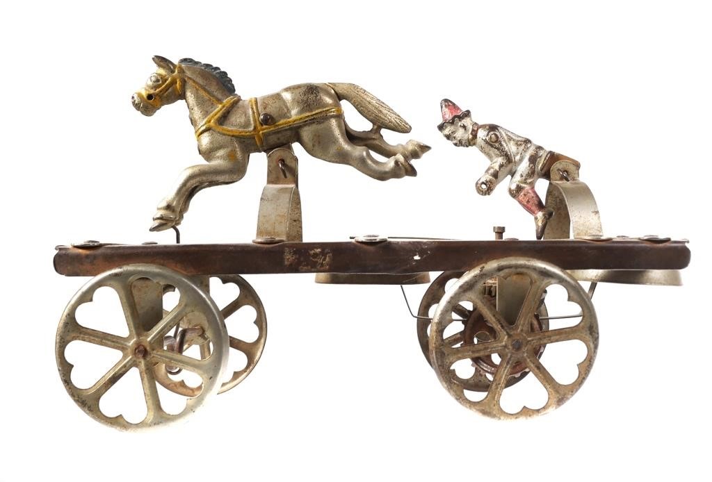 Appraisal: Cast iron figures Clown with single running horse both mounted