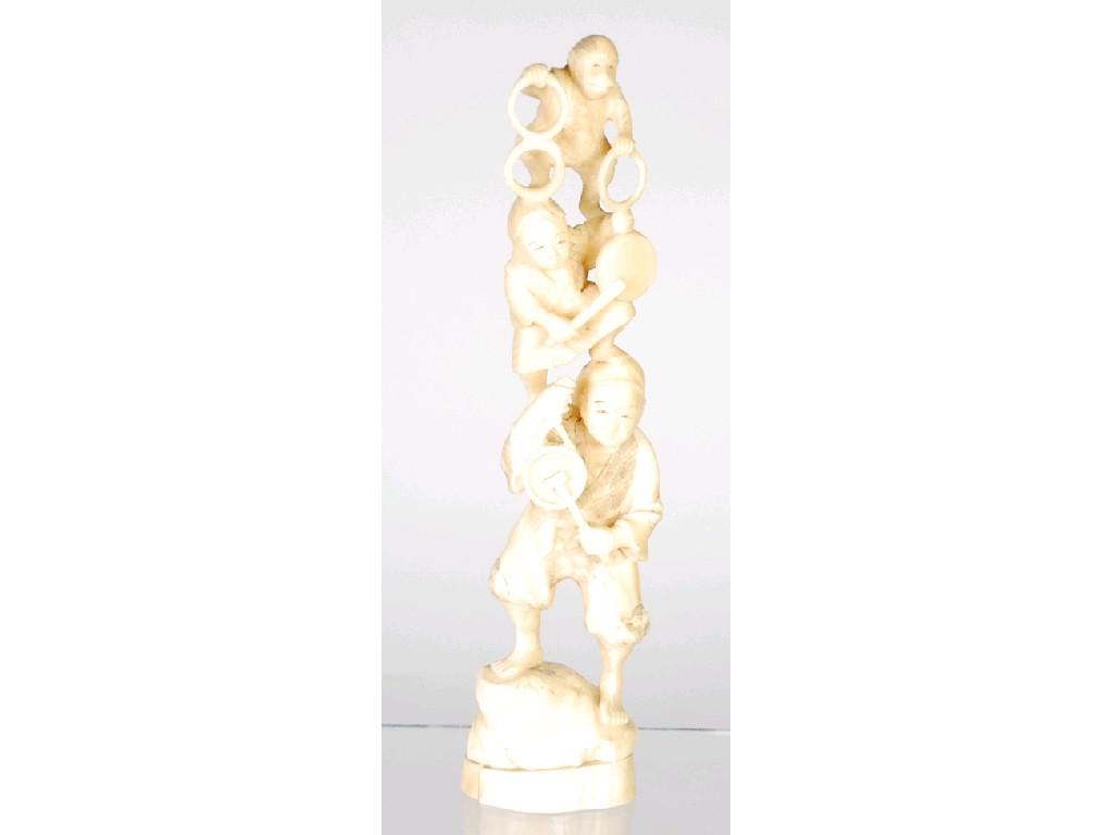 Appraisal: ORIENTAL CARVED IVORY GROUP OF ACROBATS a man with boy