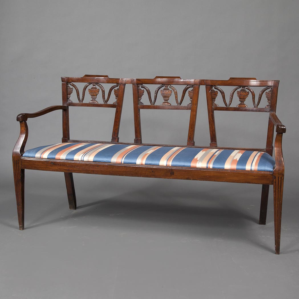 Appraisal: Italian Neoclassical Walnut Triple Chairback Settee th Century The pierced