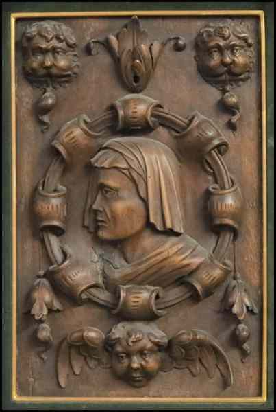 Appraisal: CONTINENTAL CARVED WOOD PLAQUE Depicting cupids surrounding a cloaked figure