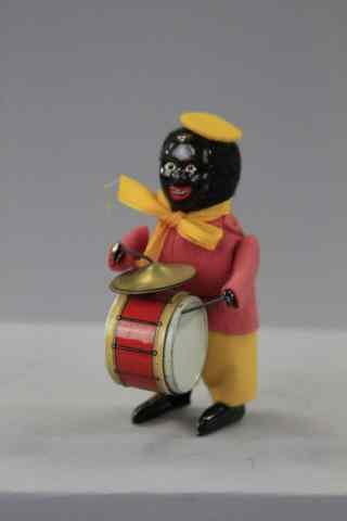 Appraisal: SCHUCO CLOWN DRUMMER Germany black tin face full felt outfit