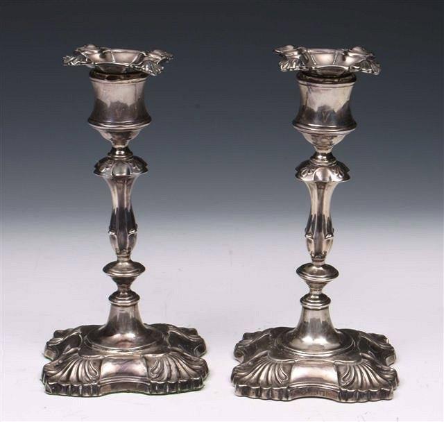 Appraisal: A PAIR OF LATE VICTORIAN SILVER CANDLE STICKS square bases