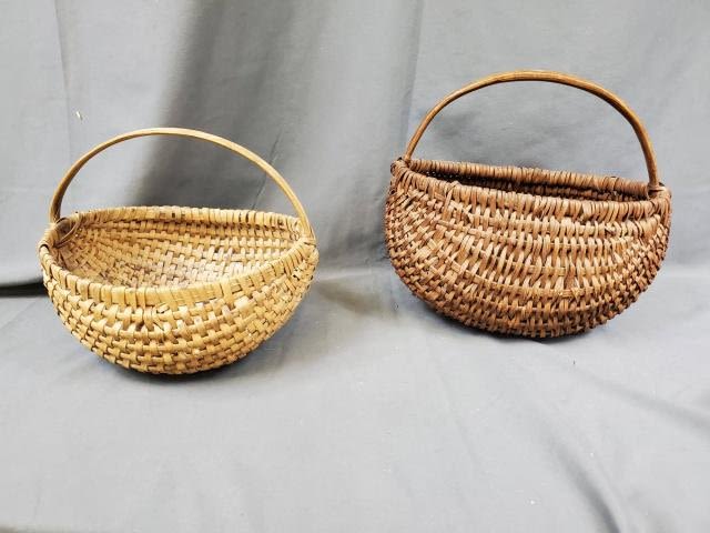 Appraisal: Two antique th century half round baskets Darker basket measures