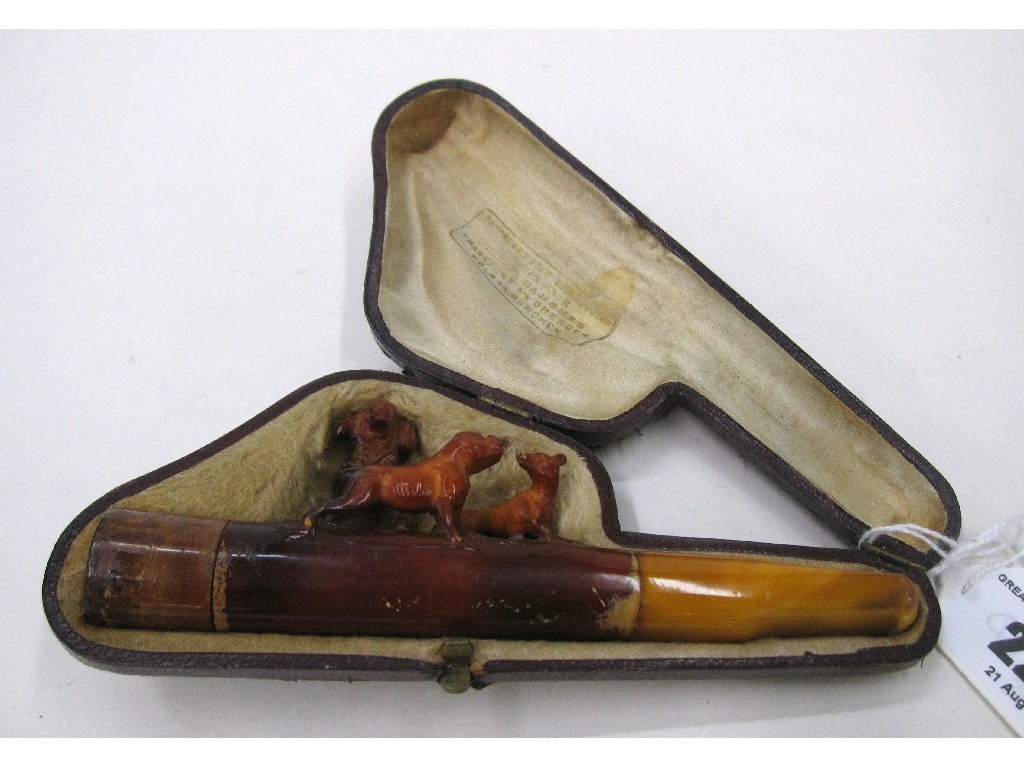 Appraisal: Cased carved amber pipe with dog figures