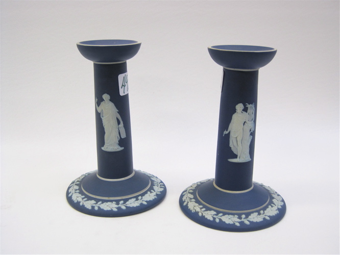 Appraisal: PAIR WEDGWOOD ETRUSIA JASPERWARE CANDLEHOLDERS white classical figures on blue