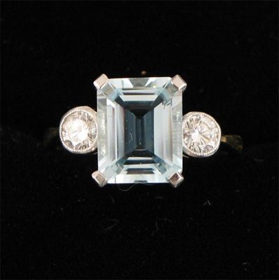 Appraisal: An aquamarine and diamond ring the emerald cut aquamarine is