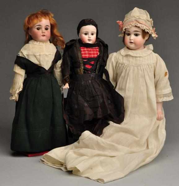 Appraisal: Lot of German Bisque Dolls Description Two are shoulder heads