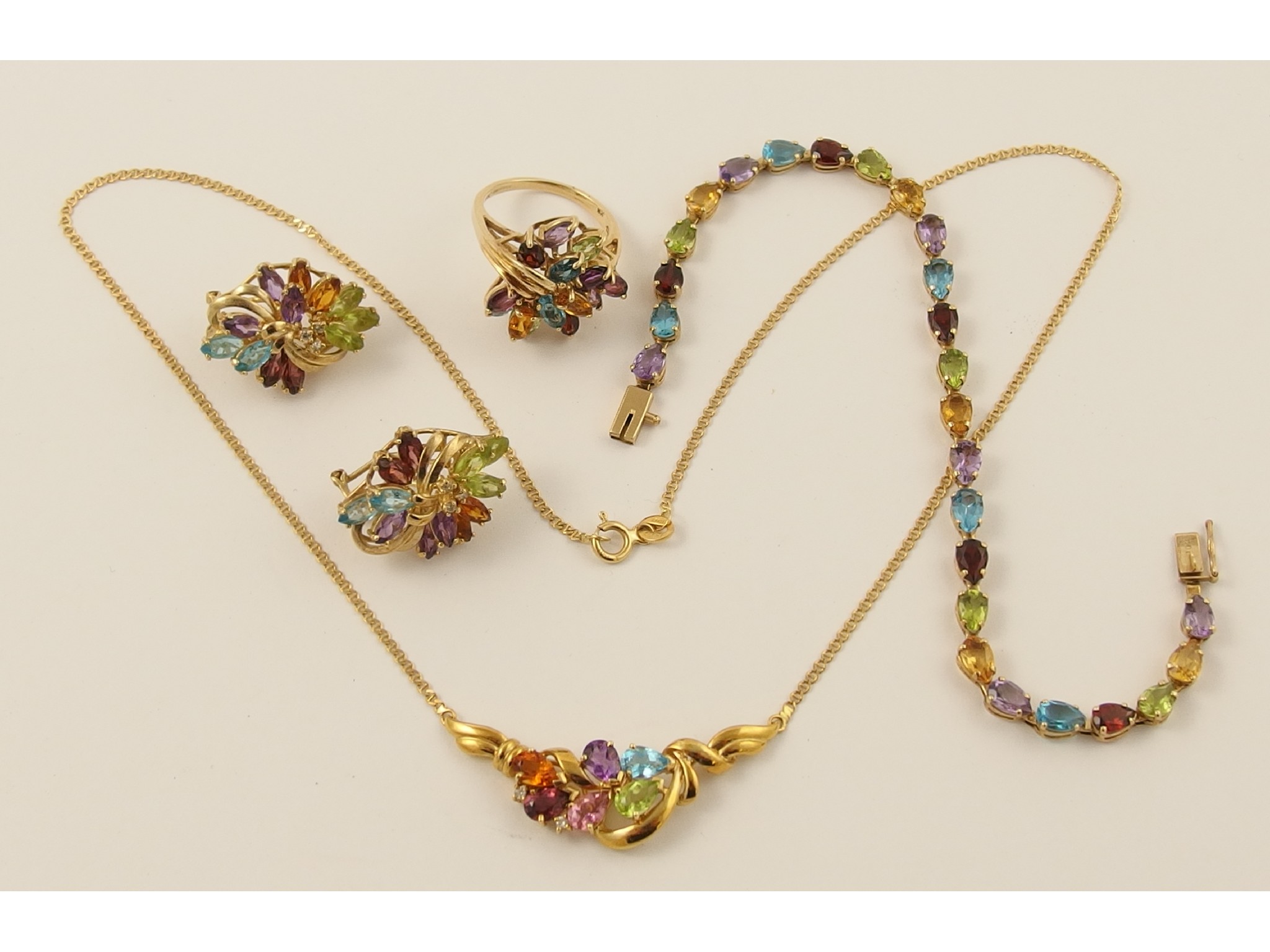 Appraisal: A tutti fruiti suite set with mixed gem stones comprising