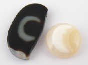 Appraisal: Two agate stones with inclusions which resemble the Islamic Hilal