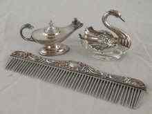 Appraisal: A mixed lot comprising a silver mounted comb a silver