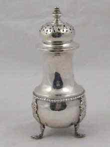 Appraisal: A silver sugar caster on three feet hallmarked Birmingham approx