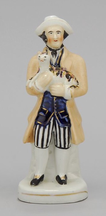 Appraisal: STAFFORDSHIRE FIGURE OF A MAN Circa Holding a calico cat