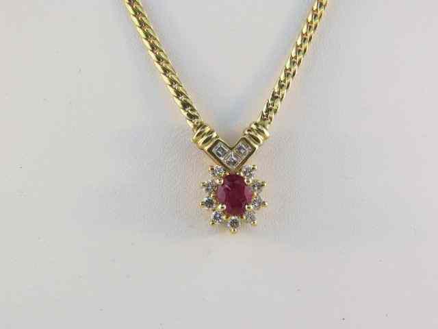 Appraisal: Ruby Diamond Necklace carat oval gem surrounded by diamonds totaling