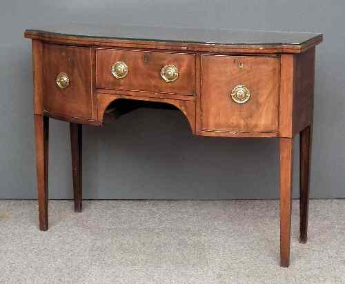 Appraisal: A late Georgian mahogany bow and break-front sideboard fitted central