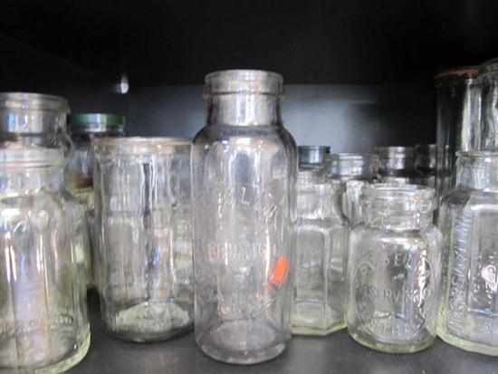 Appraisal: ONE SHELF OF ASSORTED GLASS JARS INCL COLLECTABLE ADVERTISING