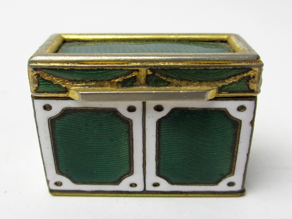 Appraisal: A gilt metal and enamel box with white framed and