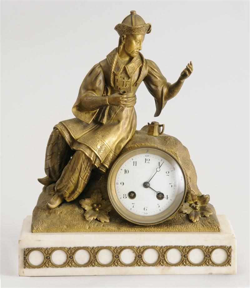 Appraisal: FRENCH GILT-METAL AND MARBLE FIGURAL CLOCK Modeled as a seated