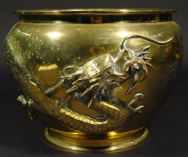 Appraisal: Large oriental bronze jardiniere cast in relief with a dragon