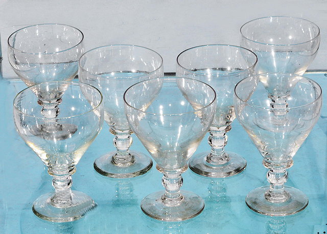 Appraisal: A SET OF SEVEN GEORGIAN STYLE GLASS GOBLETS with baluster