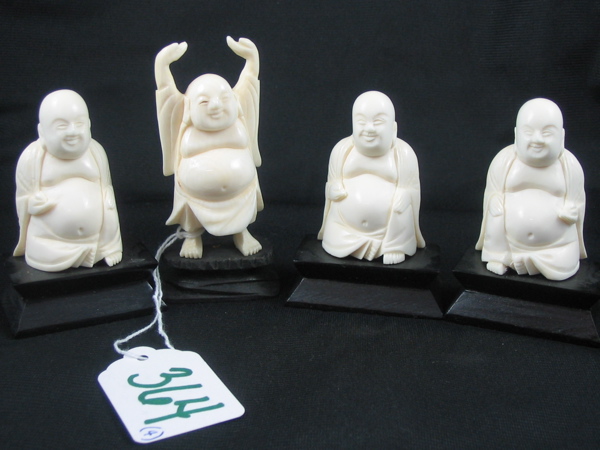 Appraisal: A GROUP OF FOUR CHINESE IVORY BUDDHA FIGURES each in