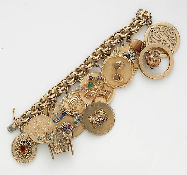 Appraisal: A gem-set and diamond charm bracelet suspending thirteen charms together