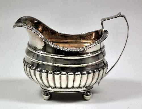 Appraisal: A George III silver rectangular milk jug with egg and