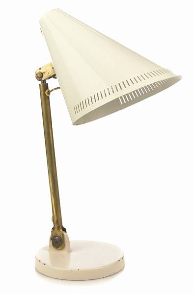 Appraisal: A Paavo Tynell brass and enameled metal adjustable desk lamp