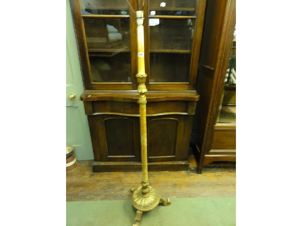 Appraisal: A gilt wood standard lamp with simple turned upholstered column