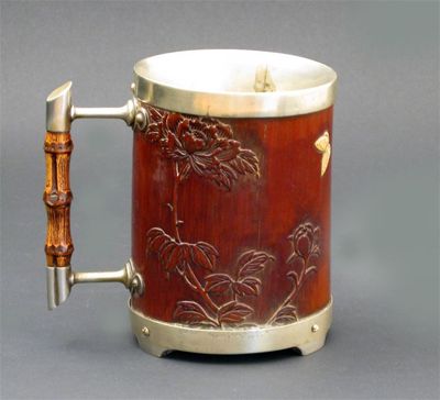 Appraisal: An interesting Hukin Heath electroplate mounted bamboo mug with rod