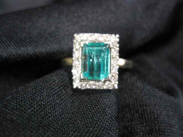 Appraisal: Emerald Diamond Ring carat emeraldcut gem surrounded by round diamonds