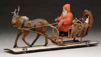 Appraisal: WHEELED PLATFORM PAPIER MACHE SANTA IN SLEIGH WITH REINDEER An