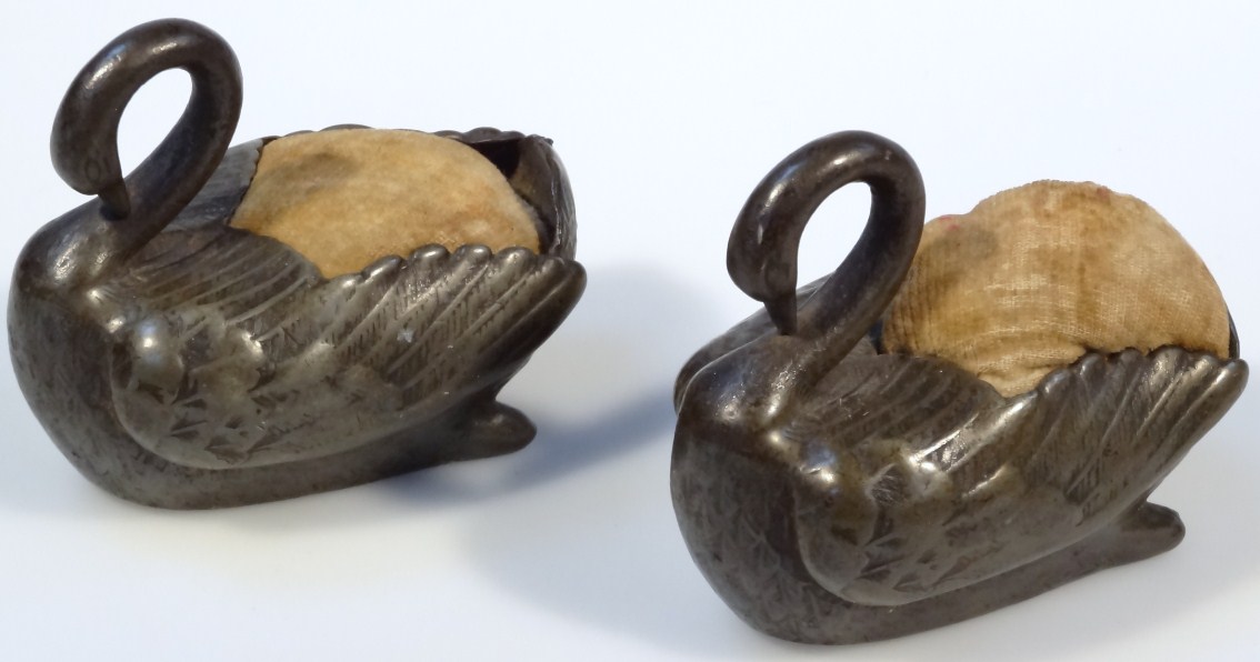 Appraisal: A pair of early thC pewter swan pin cushions with