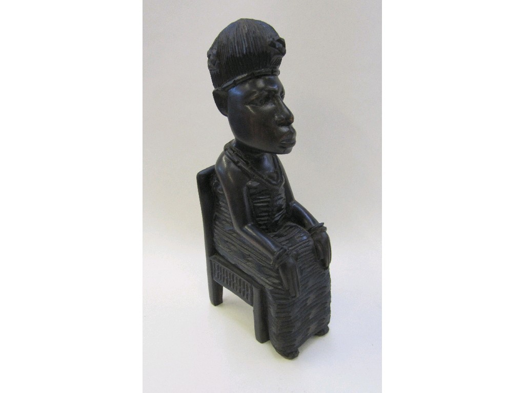 Appraisal: Carved African figure of a seated man