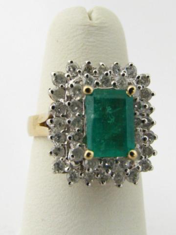 Appraisal: K yellow gold diamond emerald dinner ring containing ct emerald