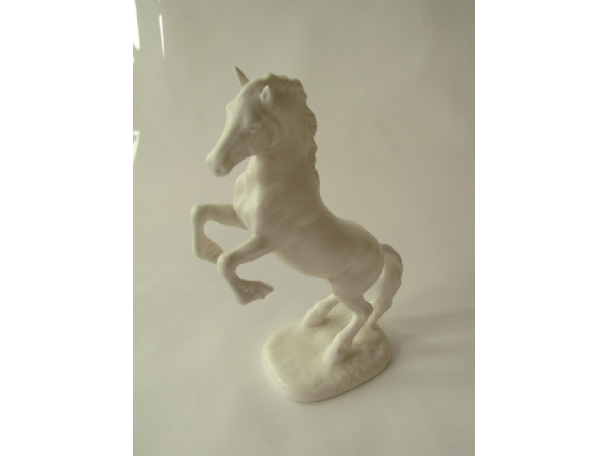 Appraisal: An unusual white matt glazed Beswick model of a rearing