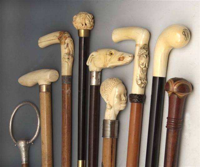 Appraisal: A MALACCA WALKING CANE with carved ivory riding crop handle