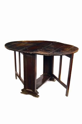 Appraisal: A rare Cromwellian oak gate leg table the oval board