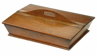 Appraisal: A Victorian oak twin lidded cutlery box with a central