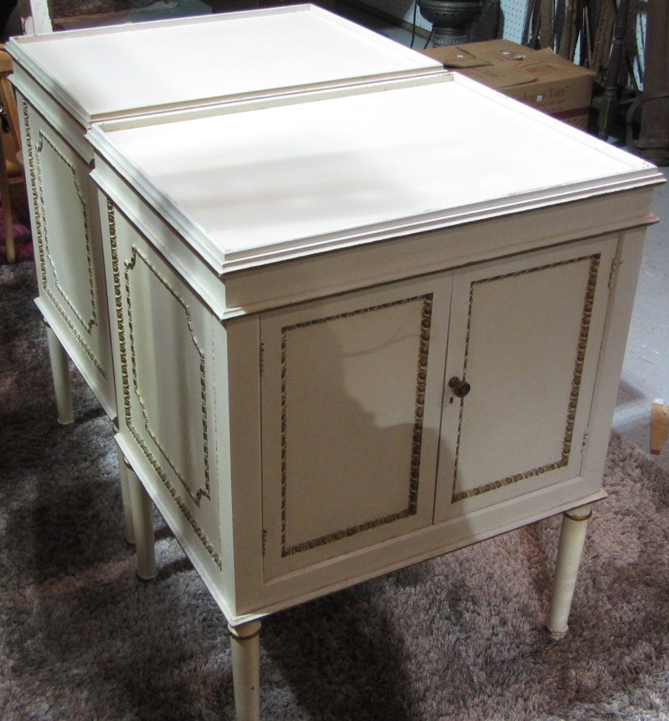 Appraisal: A pair of cream and gilt bedside tables